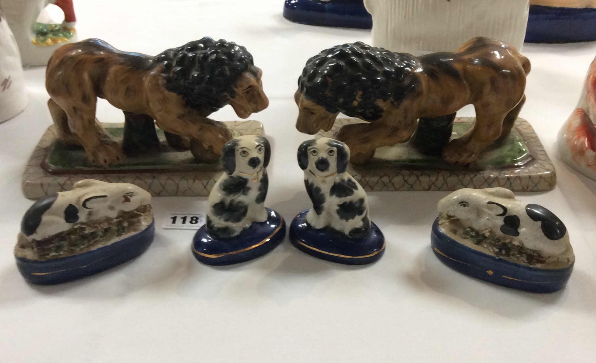 Three pairs of Staffordshire pottery animal figures,