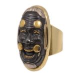 A fine Japanese shakudo mask kashira mounted as a ring