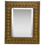 An early 20th century brass framed wall mirror,