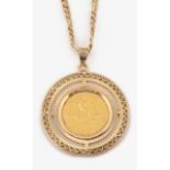 A 9ct gold pendant on chain with half sovereign