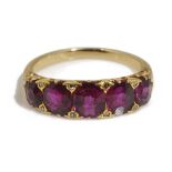 An attractive late Victorian ruby five stone half hoop ring