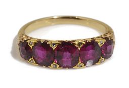 An attractive late Victorian ruby five stone half hoop ring