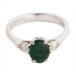 A Continental emerald and diamond three stone ring