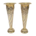 A pair of Edwardian silver-gilt spill vases