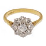 A good diamond set daisy cluster ring