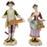 A pair of Volkstedt porcelain figures of flowers sellers
