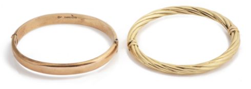 Two 9ct gold stiff bangles