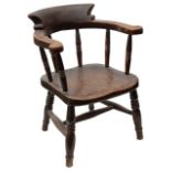 A Victorian stained beechwood child's smokers bow armchair