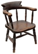 A Victorian stained beechwood child's smokers bow armchair