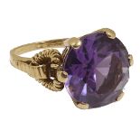 A large Continental purple gem set dress ring