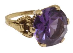 A large Continental purple gem set dress ring