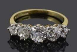 An attractive five stone graduated diamond set ring