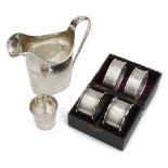 An Edwardian silver helmet shaped cream jug, a cased pair of Vict. napkin rings and other items