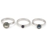 A set of three modernist 18ct gold interlocking rings