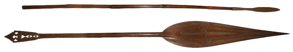 An early 20th c. South Pacific tribal carved hardwood ceremonial paddle spear