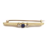 An 18ct three stone diamond and sapphire bar brooch