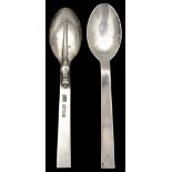 A pair of Guild of Handicrafts silver rat tail pattern teaspoons