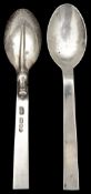 A pair of Guild of Handicrafts silver rat tail pattern teaspoons
