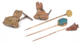 A prehistoric arrowhead mounted as a stickpin and other related items