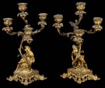 A pair of 19th c. Fr. Rococo ormolu figural four light candelabra