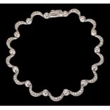 A delicate white gold and diamond set bracelet