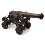 A late 19th century patinated bronze table cannon