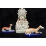 Two 19th c. Staffordshire recumbent greyhound pen stands and flatback clock group, (3)