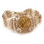 A 9ct gate bracelet with mounted half sovereign