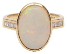 A contemporary opal and diamond set dress ring