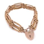 A 9ct rose gold fancy link four bar gate bracelet