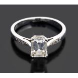 A single stone emerald cut diamond set ring