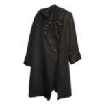 An Edwardian lady's black satin long evening coat