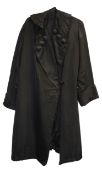 An Edwardian lady's black satin long evening coat