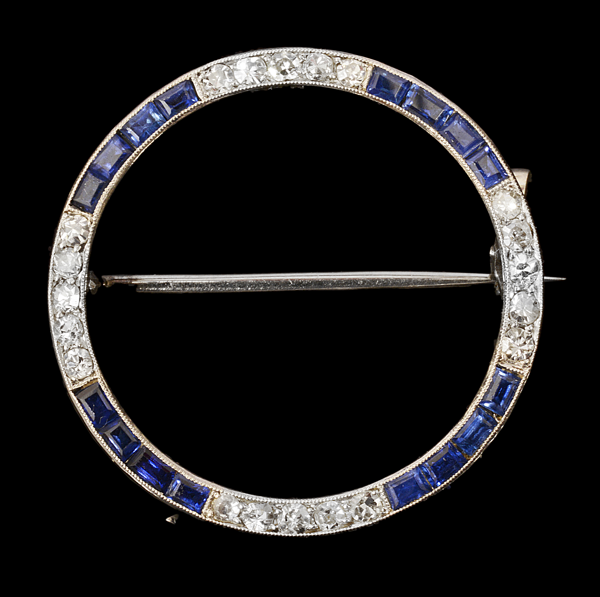 An Art Deco sapphire and diamond-set brooch