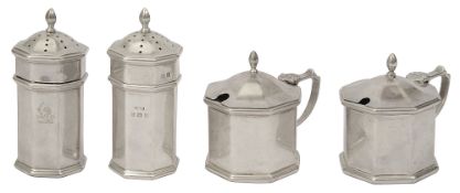 A matched George V silver four piece cruet set in George I style