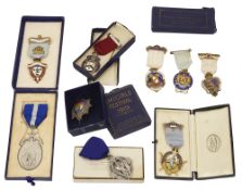 A small collection of early 20th century mostly enamelled silver Masonic jewels