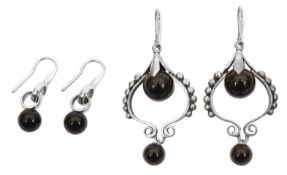 Two pairs of Georg Jensen Sterling silver and onyx drop earrings,