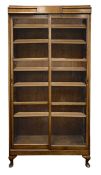 A 1930s walnut glazed bookcase