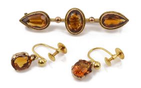 A mid Victorian citrine and yellow gold brooch together with a pair of ear pendants