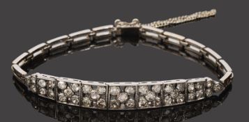 A delicate Edwardian articulated diamond cluster bracelet