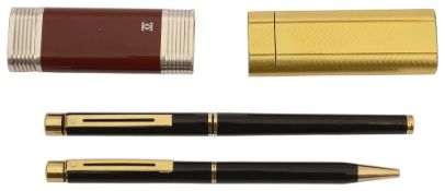 Two Cartier gas lighters and a pair of Schaeffer pens