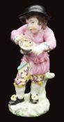 A Derby porcelain figure of a boy emblematic of Winter from a series of the Four Seasons, c.1775