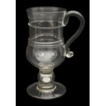 A large 19th century glass coin tankard