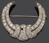 An Art Deco diamond-set crescent brooch, set throughout with single-cut diamonds