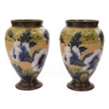 A pair or Doulton Lambeth Slater Patent stoneware vases by Emily Partington,
