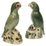 A matched pair Chinese export famille verte biscuit models of parrots