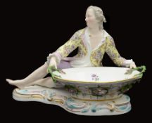 A large late 19th century Meissen style porcelain figural sweetmeat basket