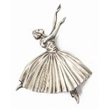 A silver brooch in the form of a ballerina,