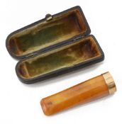 A late Victorian 15 carat gold mounted amber cheroot holder