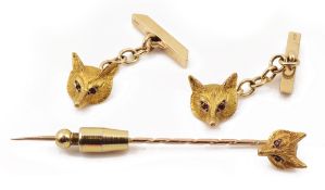 A pair of 9ct gold fox mask head cufflinks and a fox tie pin